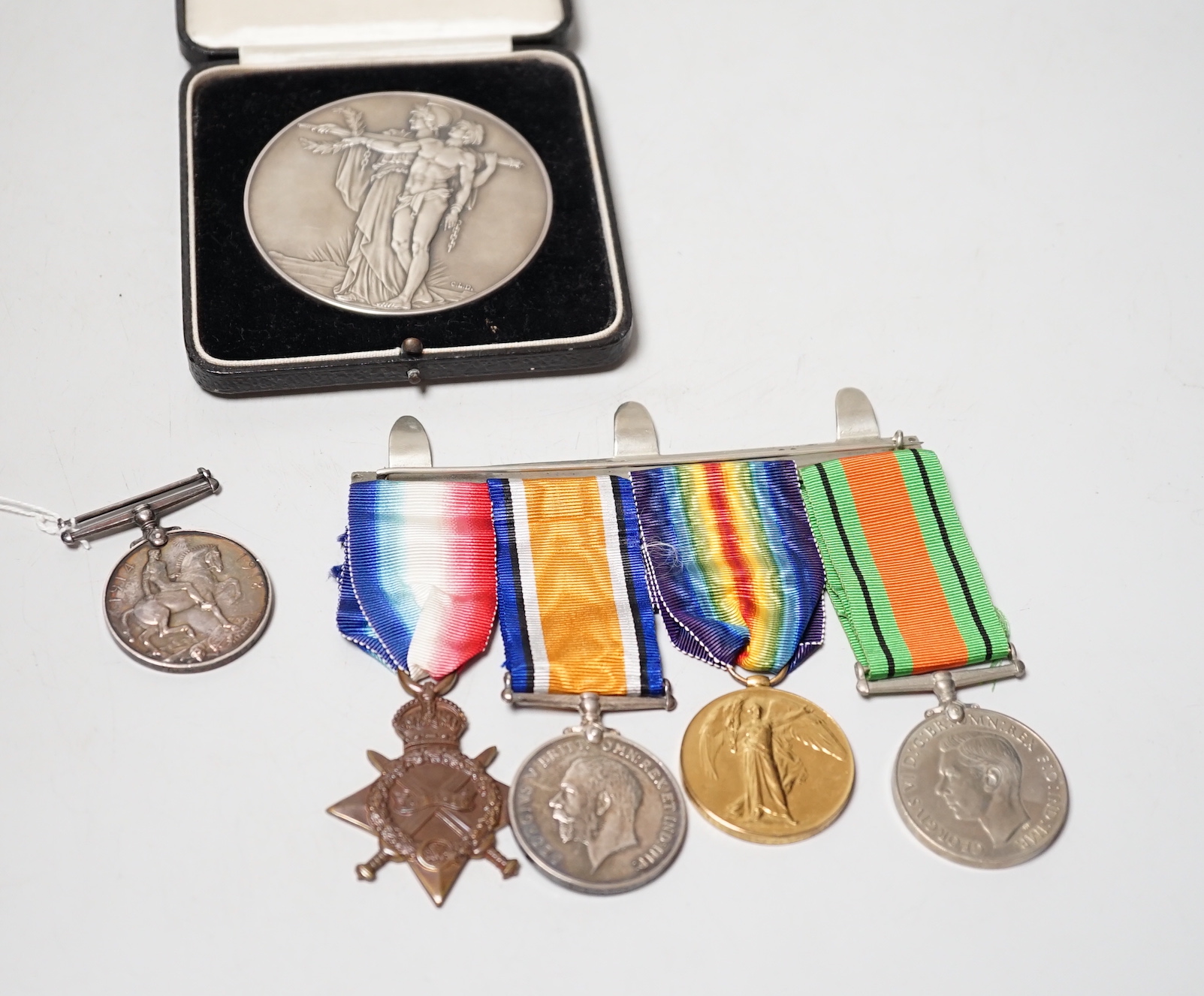 A World War I/World War II group of four Medals to M2–101459 PTE. J. Bourne. A.S.C., A war medal two second lieutenant J D Head and An Opening of the Cenotaph large silver medal, 75 mm